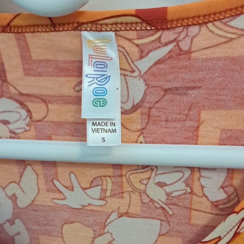 LuLaRoe Disney Peach and Beige Graphic Top